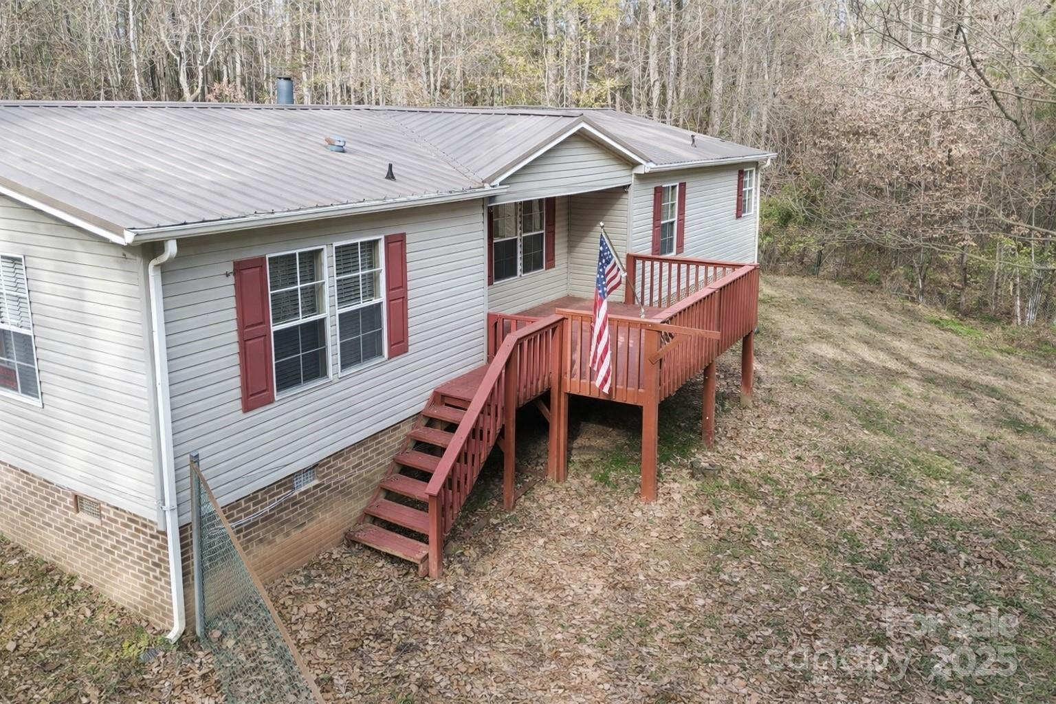3215 Shadybark Trail Catawba, SC 29704 - Photo 2 of 36 a view of a house with a yard and wooden deck