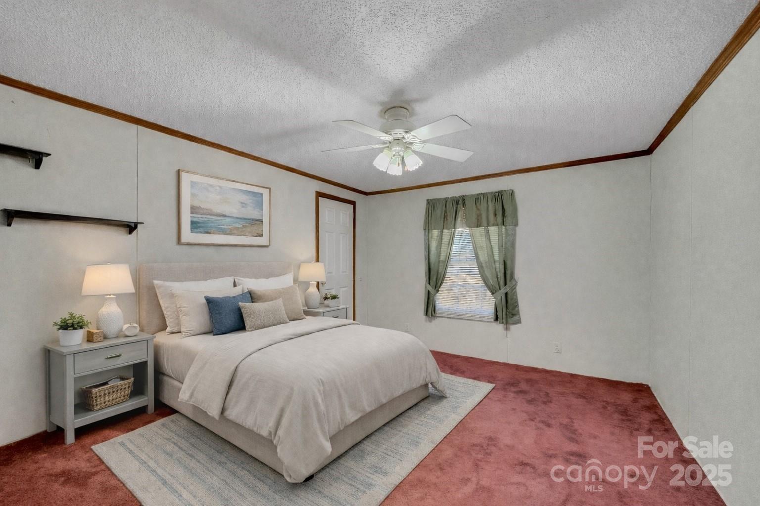 3215 Shadybark Trail Catawba, SC 29704 - Photo 25 of 36 a bedroom with a large bed and a chandelier