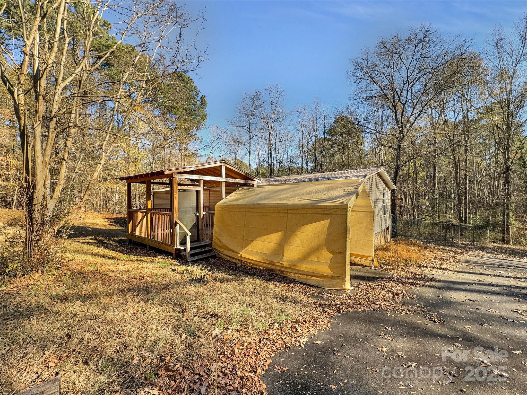 3215 Shadybark Trail Catawba, SC 29704 - Photo 34 of 36 a view of a backyard with wooden fence and a large tree