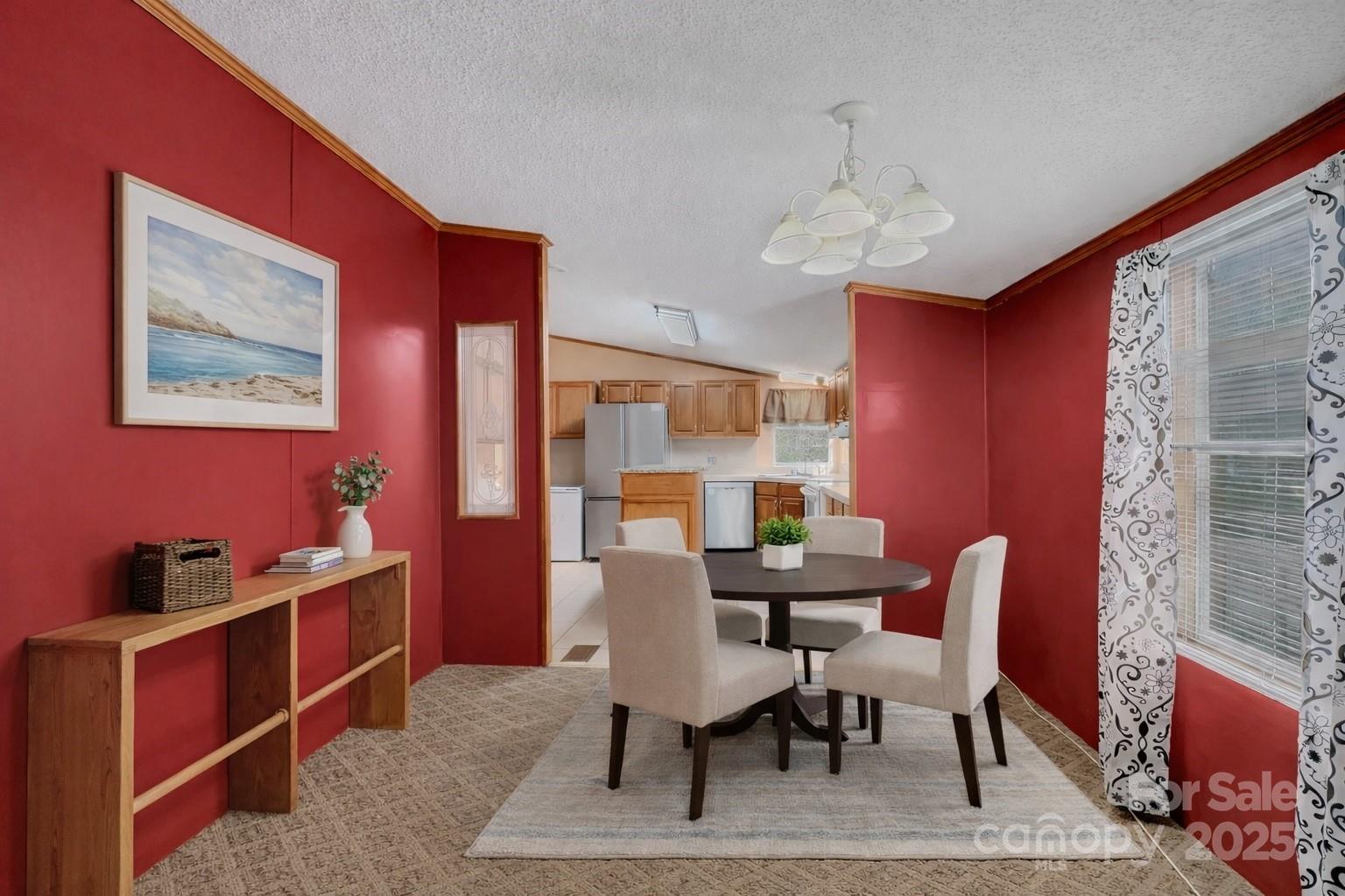 3215 Shadybark Trail Catawba, SC 29704 - Photo 9 of 36 a view of a dining room with furniture window and wooden floor