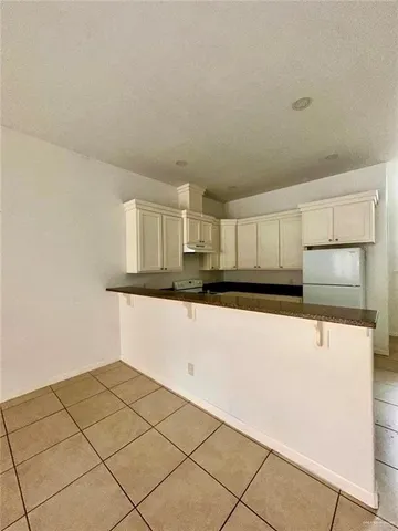 a kitchen with a cabinets and window