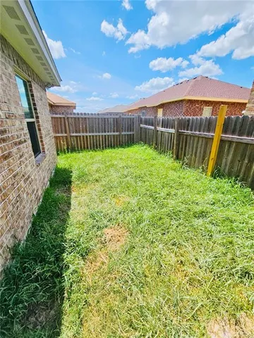 a view of a garden with a fence