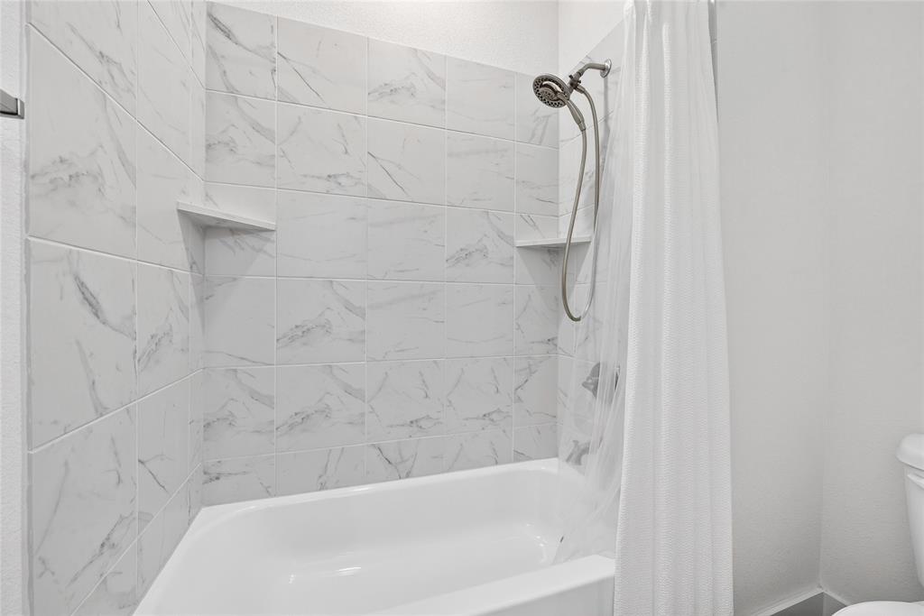 209 Basalt Lane Azle, TX 76020 - Photo 12 of 39 a bathroom with a shower