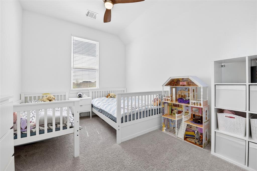 209 Basalt Lane Azle, TX 76020 - Photo 13 of 39 a bedroom with a bed and a window