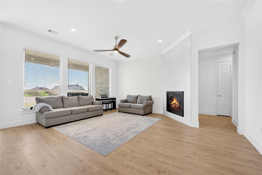 209 Basalt Lane Azle, TX 76020 - Photo 14 of 39 a living room with furniture and a fireplace