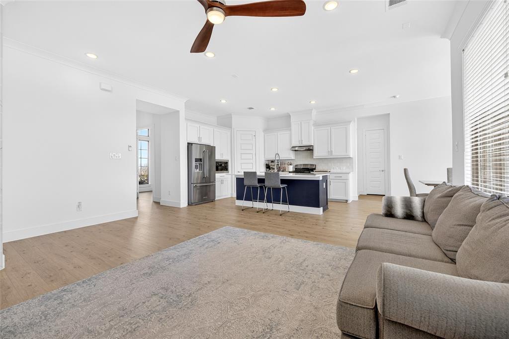 209 Basalt Lane Azle, TX 76020 - Photo 16 of 39 a living room with stainless steel appliances furniture cabinets and a kitchen view