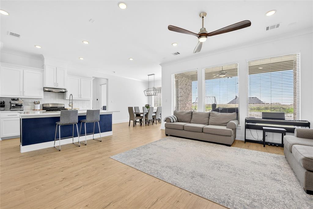 209 Basalt Lane Azle, TX 76020 - Photo 17 of 39 a living room with furniture kitchen area and a window