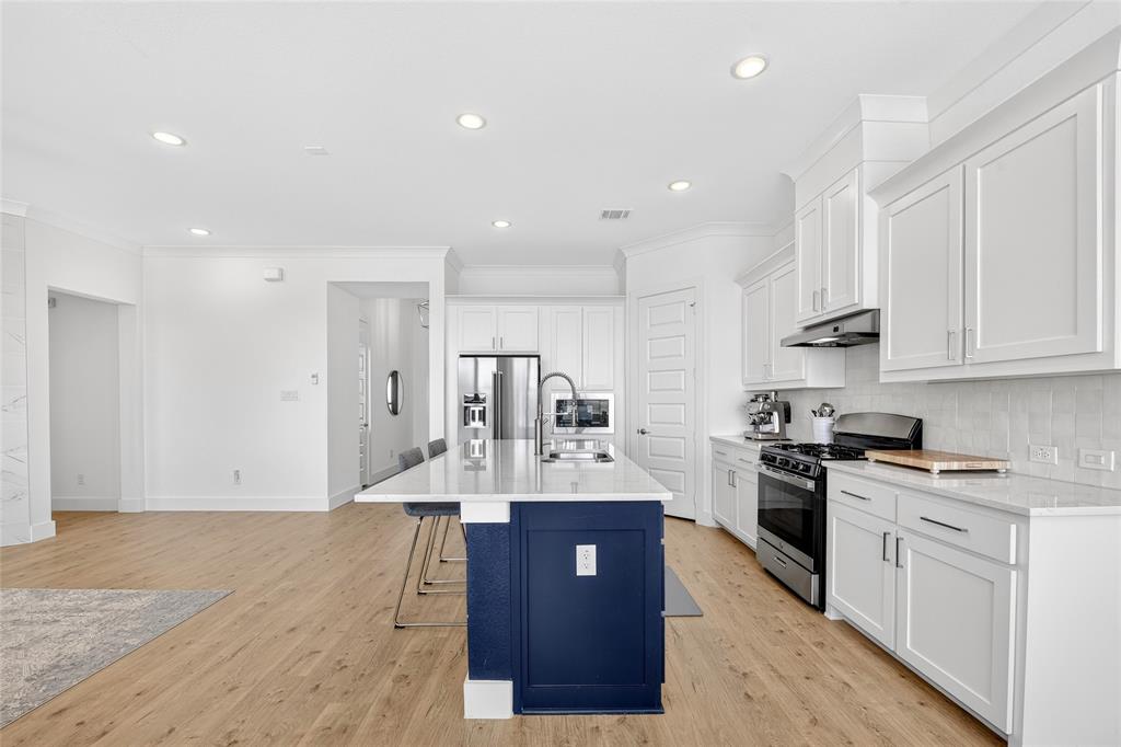 209 Basalt Lane Azle, TX 76020 - Photo 21 of 39 a large kitchen with stainless steel appliances lots of counter top space