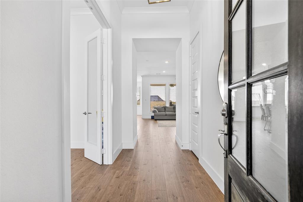 209 Basalt Lane Azle, TX 76020 - Photo 24 of 39 a view of a hallway with wooden floor and staircase