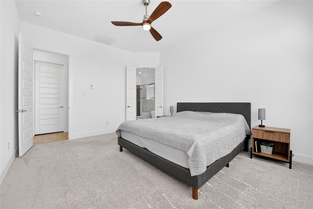 209 Basalt Lane Azle, TX 76020 - Photo 27 of 39 a bedroom with a bed and a ceiling fan