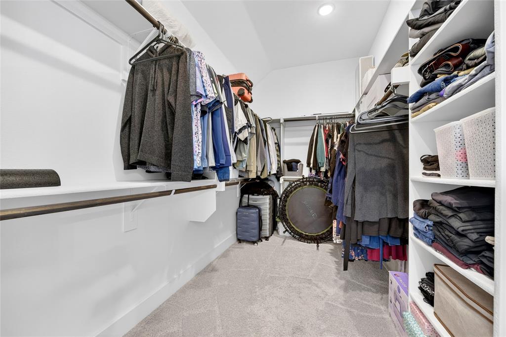 209 Basalt Lane Azle, TX 76020 - Photo 29 of 39 a view of walk in closet with clothes and shoes