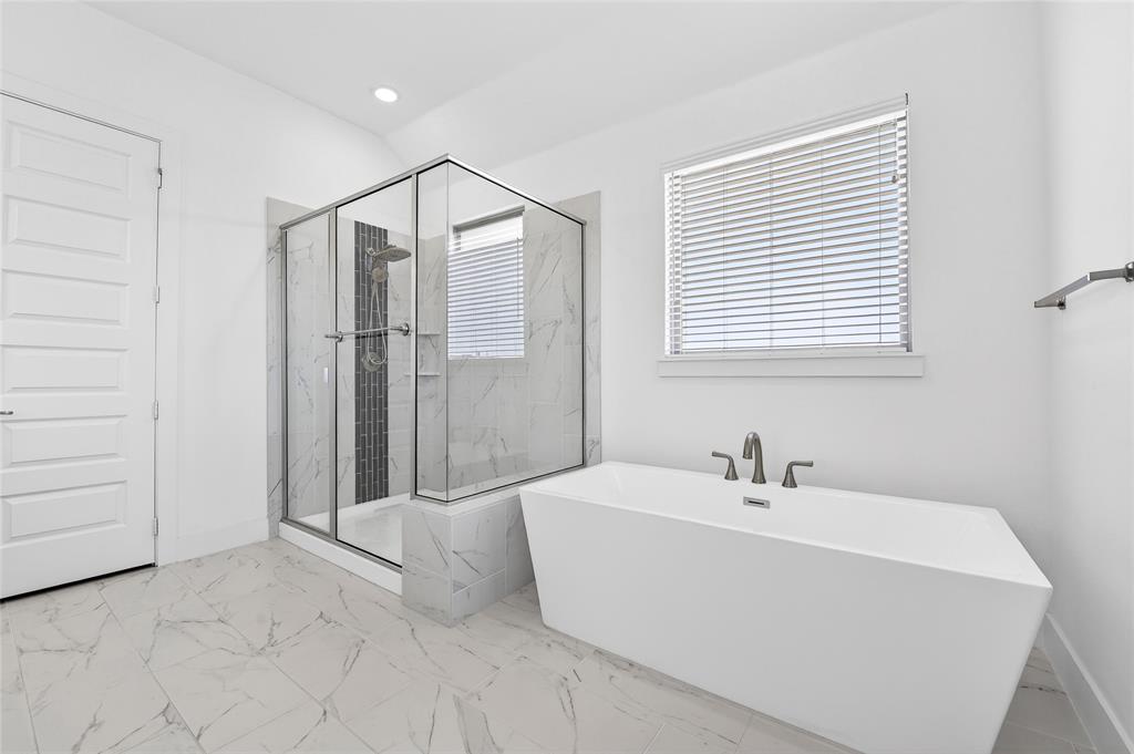 209 Basalt Lane Azle, TX 76020 - Photo 30 of 39 a bathroom with a bathtub and a shower