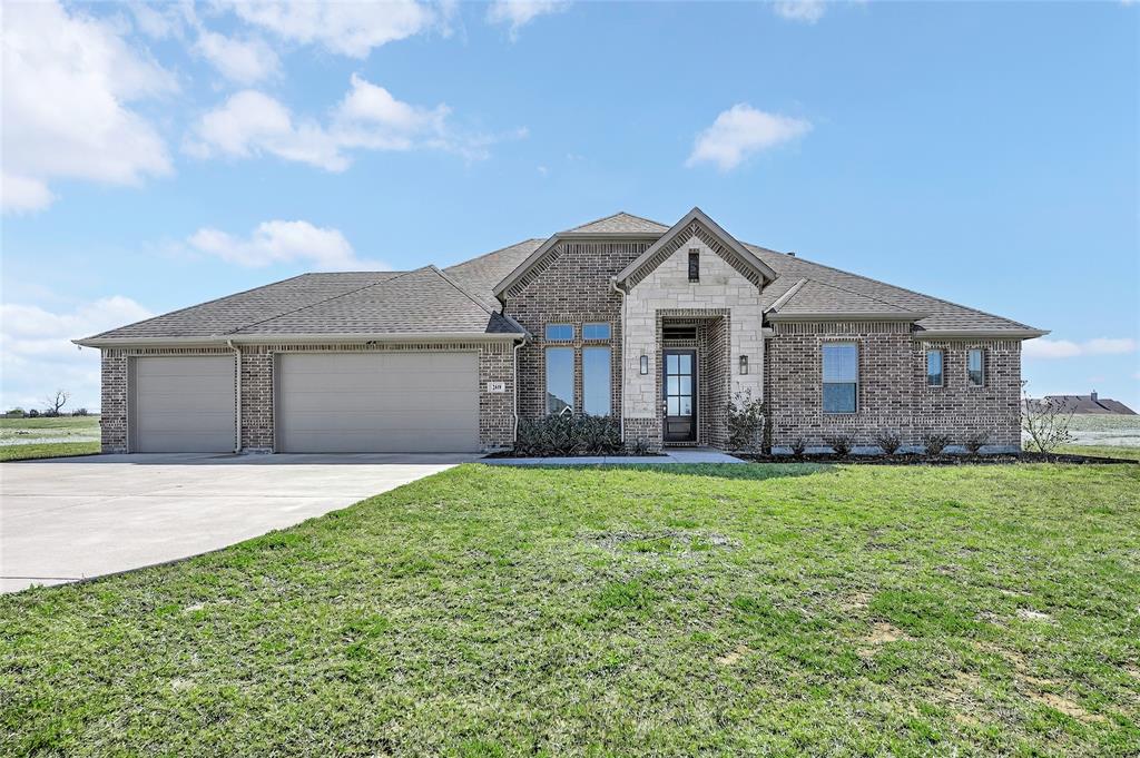 209 Basalt Lane Azle, TX 76020 - Photo 3 of 39 a front view of a house with yard