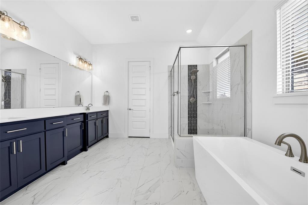 209 Basalt Lane Azle, TX 76020 - Photo 31 of 39 a bathroom with a tub sink shower and mirror
