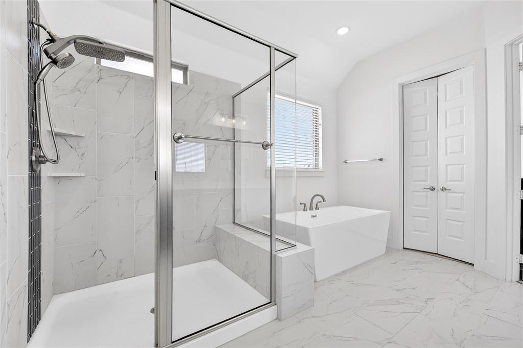 209 Basalt Lane Azle, TX 76020 - Photo 32 of 39 a bathroom with a bathtub and a shower