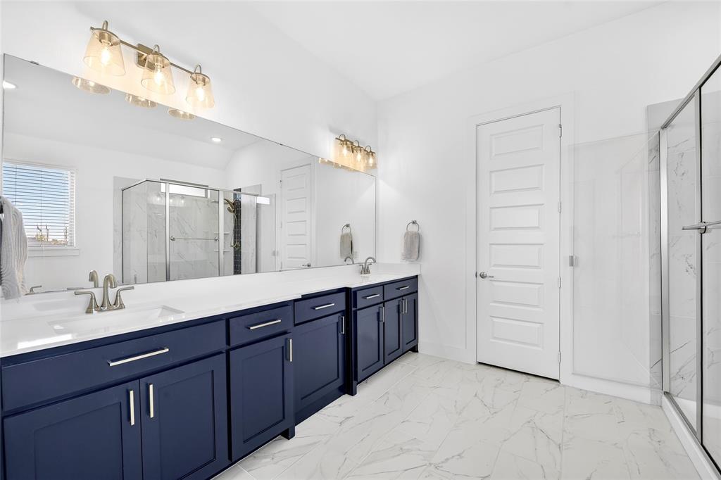 209 Basalt Lane Azle, TX 76020 - Photo 33 of 39 a spacious bathroom with a double vanity sink and a mirror