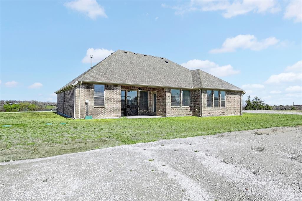 209 Basalt Lane Azle, TX 76020 - Photo 4 of 39 a view of a house with a yard