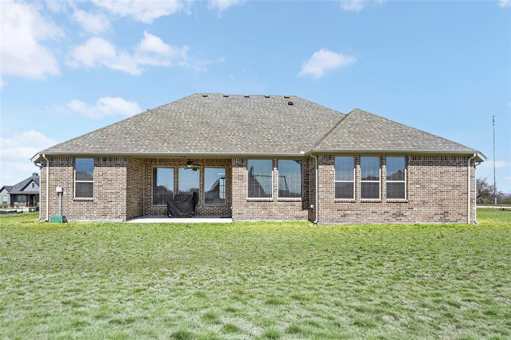 209 Basalt Lane Azle, TX 76020 - Photo 5 of 39 a house view with a garden space