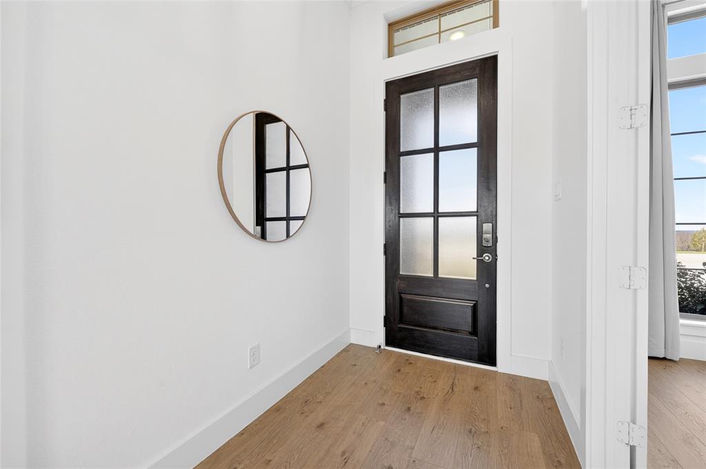 209 Basalt Lane Azle, TX 76020 - Photo 6 of 39 a view of staircase with wooden floor and white wall