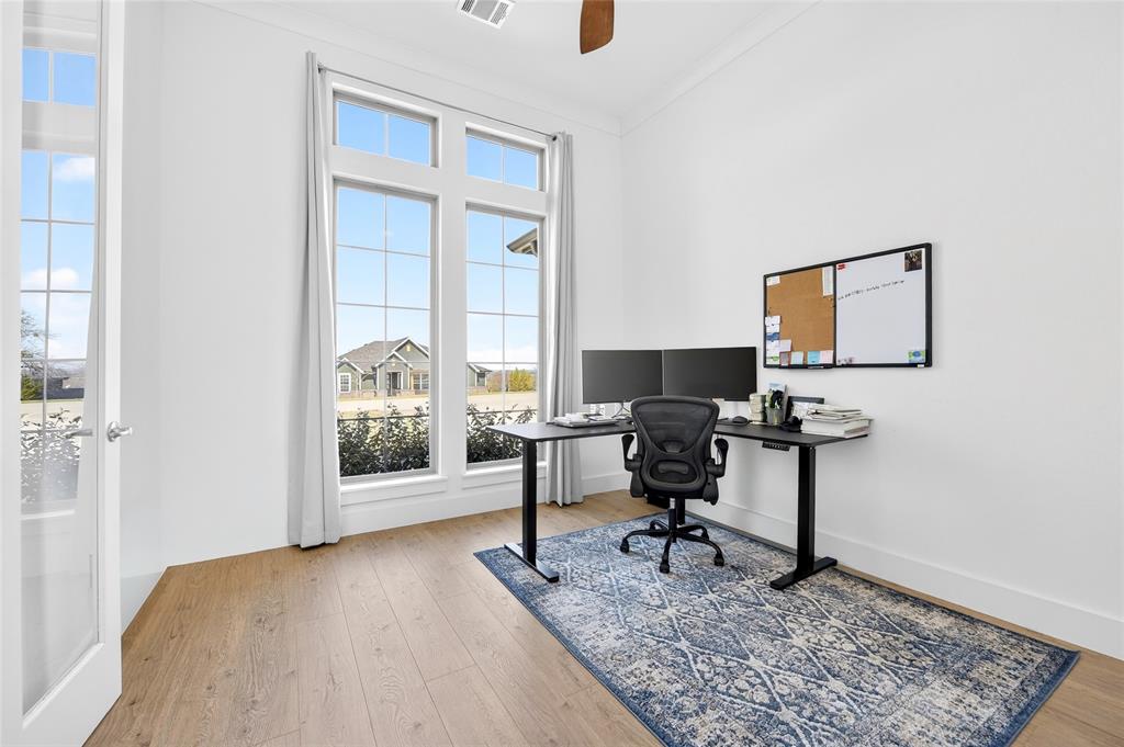209 Basalt Lane Azle, TX 76020 - Photo 7 of 39 a view of a workspace with furniture and a window
