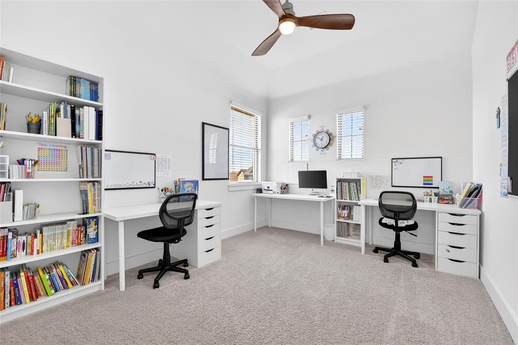 209 Basalt Lane Azle, TX 76020 - Photo 10 of 39 a view of a workspace with furniture and a bookshelf