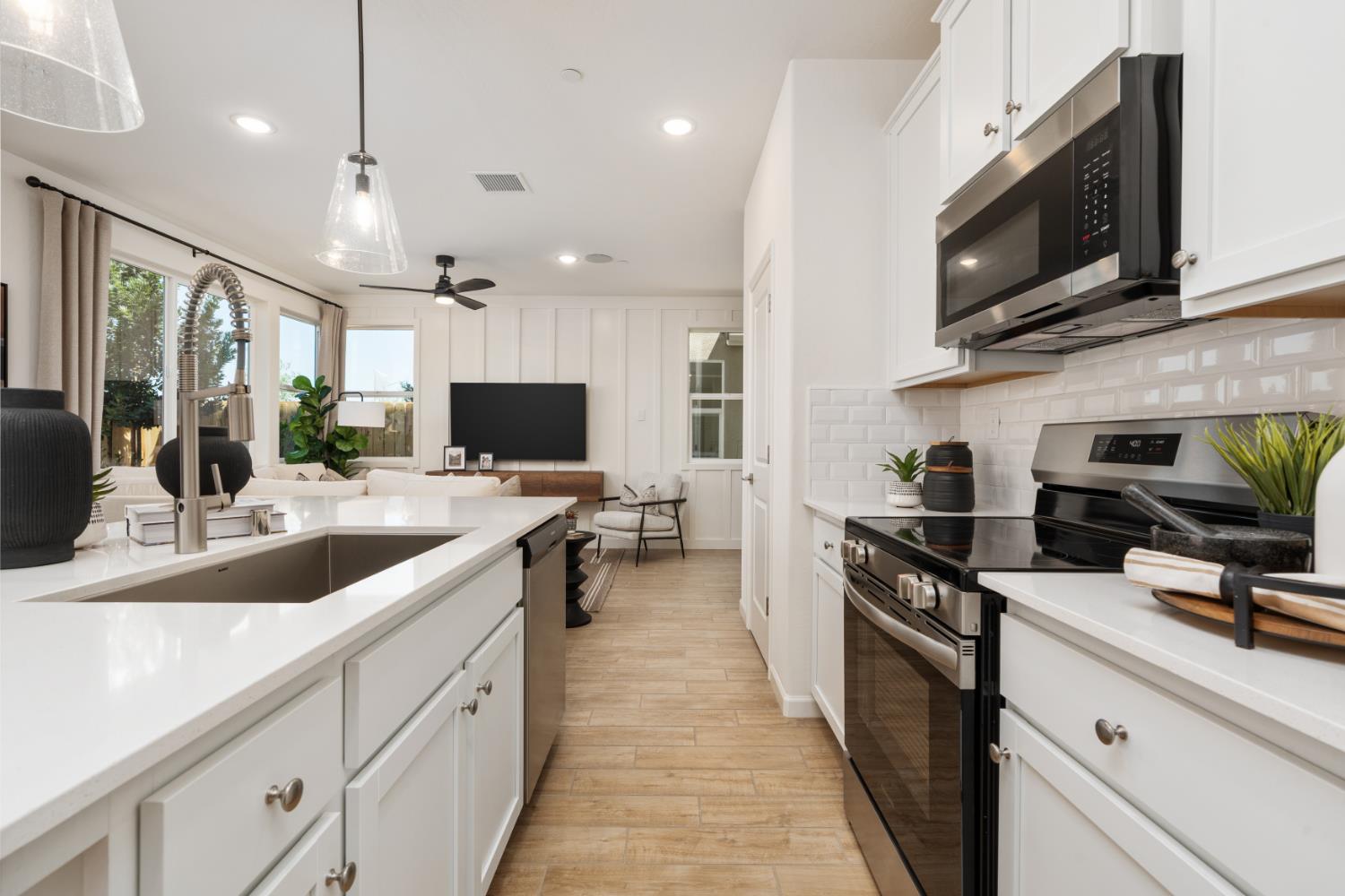 1508 Redbrick Lane Clovis, CA 93619 - Photo 12 of 33 a large kitchen with a large counter top appliances and cabinets