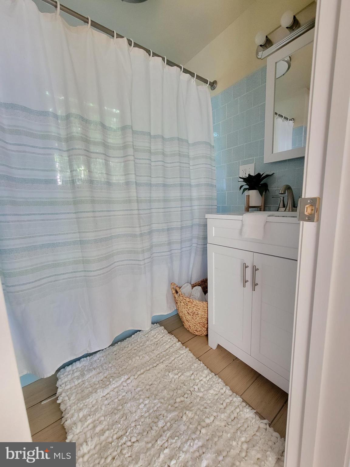 201 Grainery Road Montross, VA 22520 - Photo 8 of 9 a bathroom with a sink and a mirror