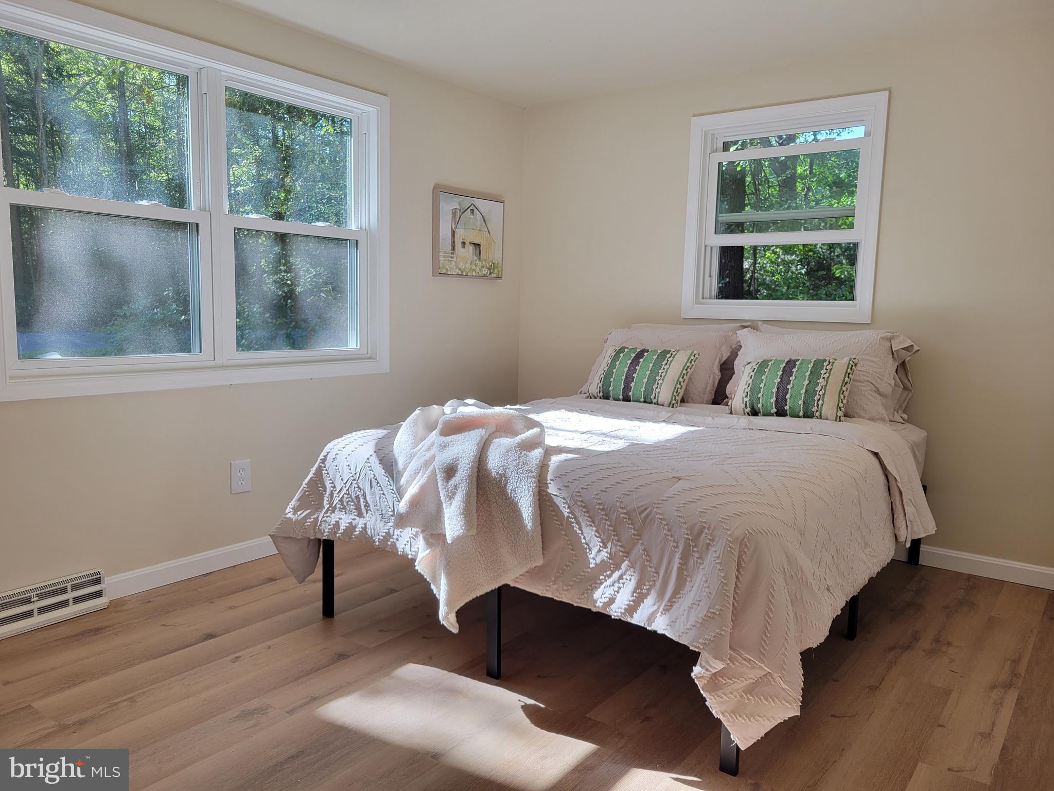 201 Grainery Road Montross, VA 22520 - Photo 9 of 9 a bed sitting in a bedroom next to a window