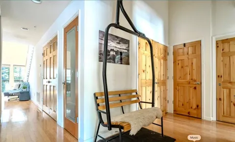 a bedroom with a bed and large window