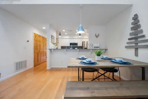 a kitchen with a sink and a refrigerator