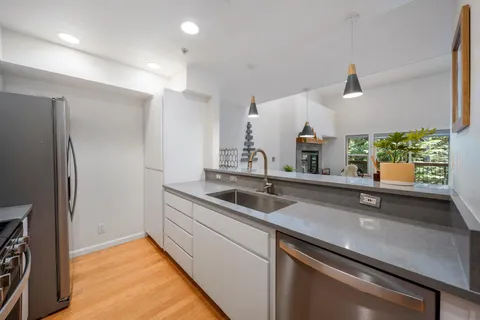 a living room with furniture a fireplace and a table
