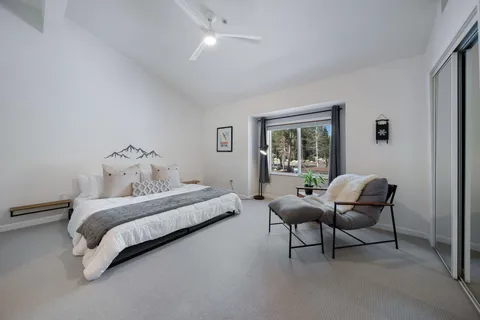 a view of a hallway with furniture and front door