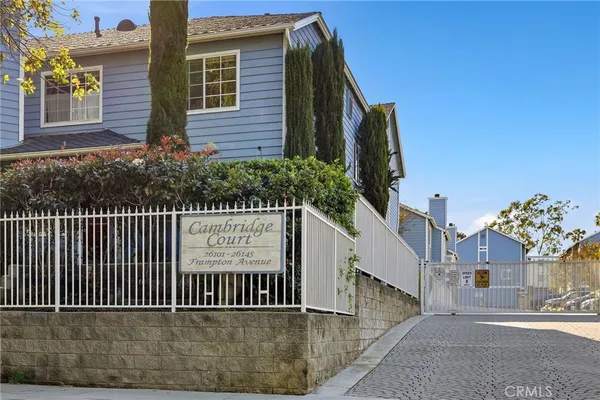 a view of a house with a small yard