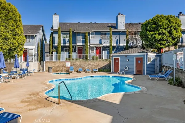 a view of a house with backyard porch and sitting area