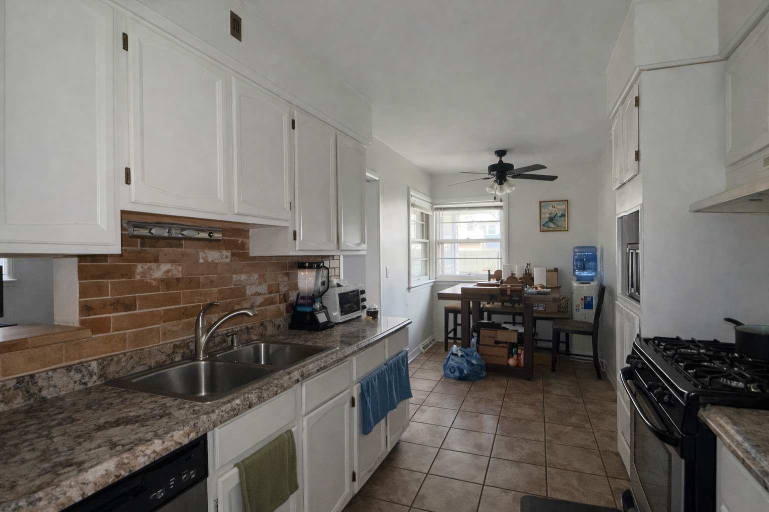 502 South Edward Street Mount Prospect, IL 60056 - Photo 3 of 7 a kitchen with granite countertop a sink stove and cabinets