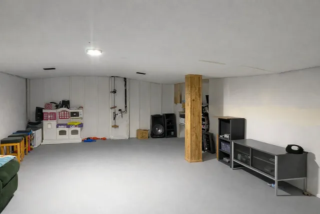 a view of work space with furniture and a flat screen tv