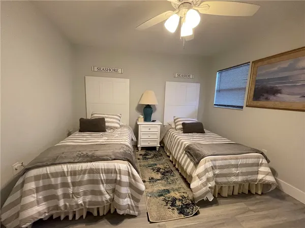 a bedroom with double bed and a window