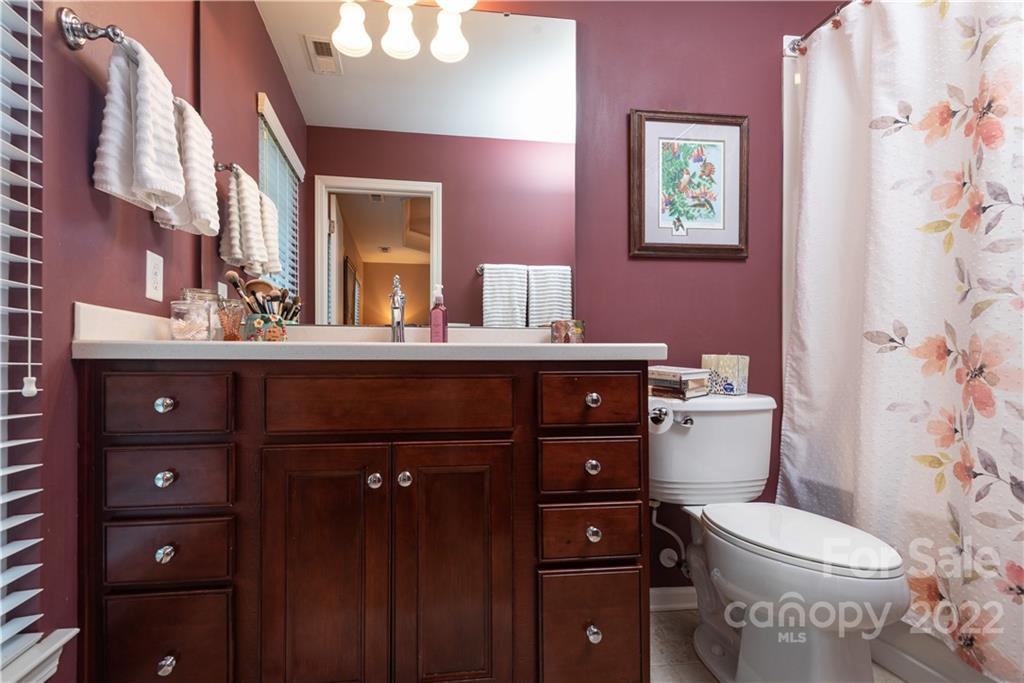 1132 Drayton Court, Unit 130 Fort Mill, SC 29708 - Photo 14 of 24 a bathroom with a sink vanity mirror and toilet