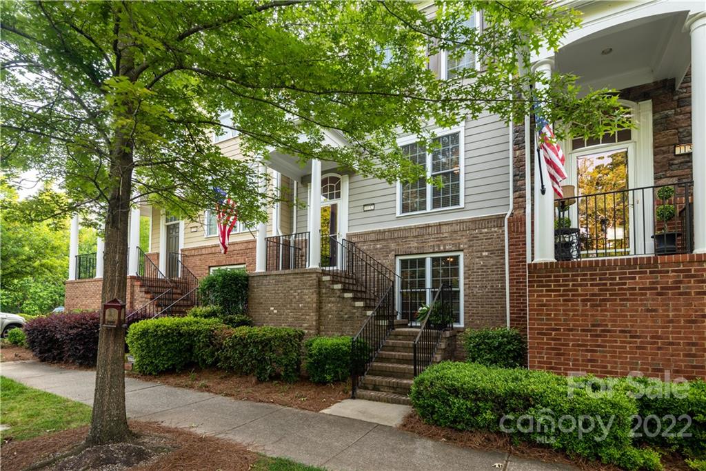 1132 Drayton Court, Unit 130 Fort Mill, SC 29708 - Photo 2 of 24 a front view of a house with a garden