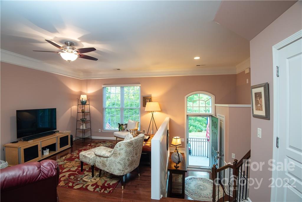 1132 Drayton Court, Unit 130 Fort Mill, SC 29708 - Photo 4 of 24 a living room with furniture a flat screen tv and a large window
