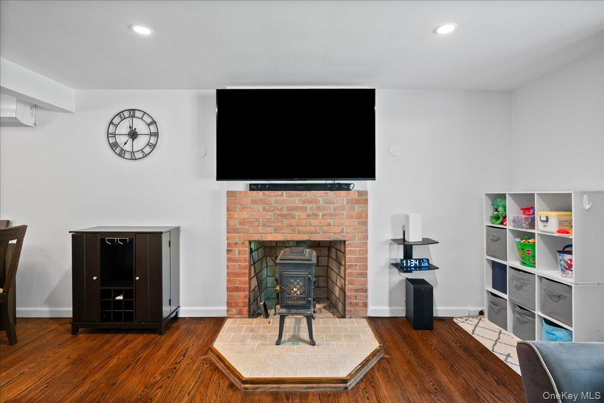 105 High St Extension Mount Kisco, NY 10549 - Photo 15 of 38 a living room with furniture and a fireplace