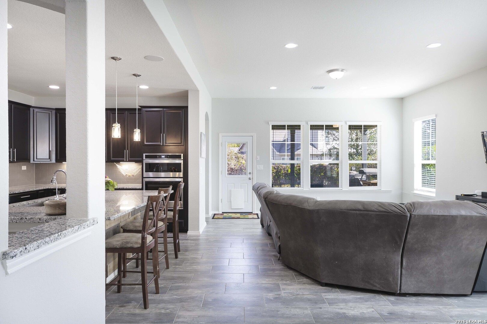11638 Chalk Stem Schertz, TX 78154 - Photo 13 of 37 a living room with furniture and kitchen view
