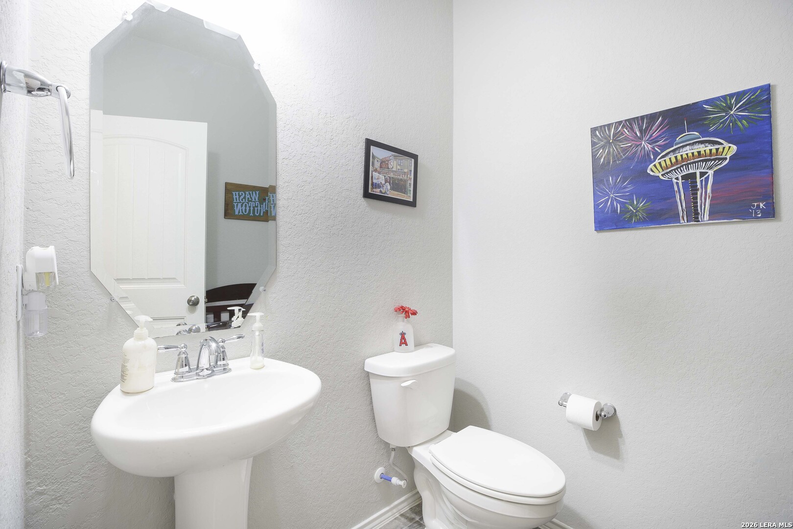 11638 Chalk Stem Schertz, TX 78154 - Photo 18 of 37 a bathroom with a toilet a sink and a mirror
