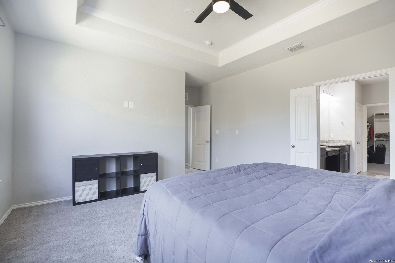 11638 Chalk Stem Schertz, TX 78154 - Photo 21 of 37 a spacious bedroom with a bed and a ceiling fan