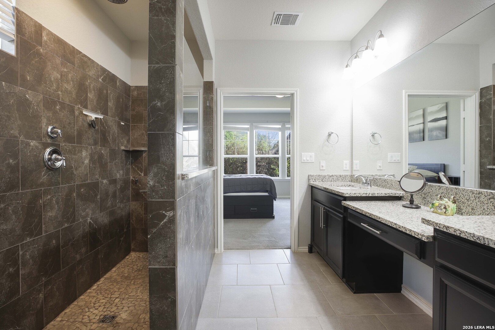 11638 Chalk Stem Schertz, TX 78154 - Photo 23 of 37 a en suite bathroom with a granite countertop double vanity and a shower