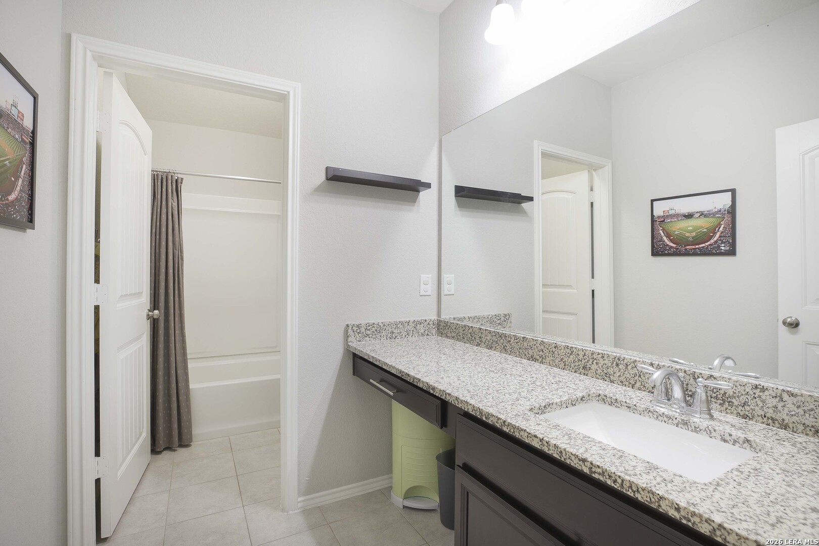 11638 Chalk Stem Schertz, TX 78154 - Photo 30 of 37 a bathroom with a granite countertop sink and a mirror