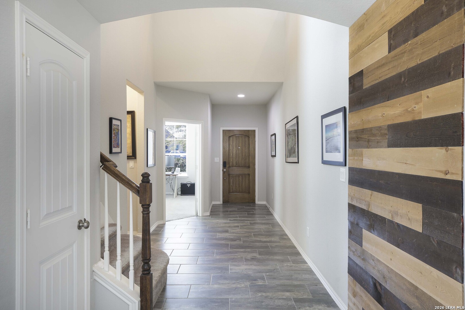 11638 Chalk Stem Schertz, TX 78154 - Photo 5 of 37 a view of a hallway view with wooden floor and staircase