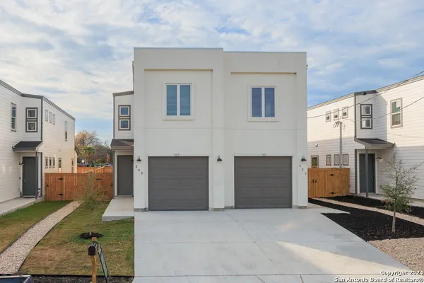 a view of a house with a parking space