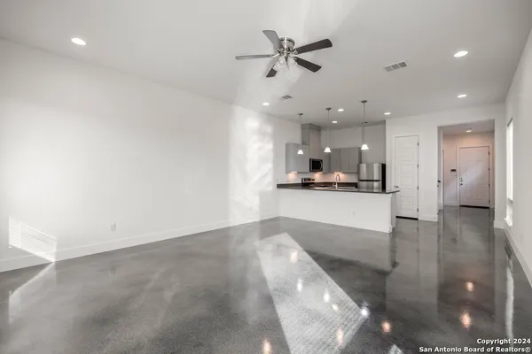 a view of a kitchen with a sink and an oven