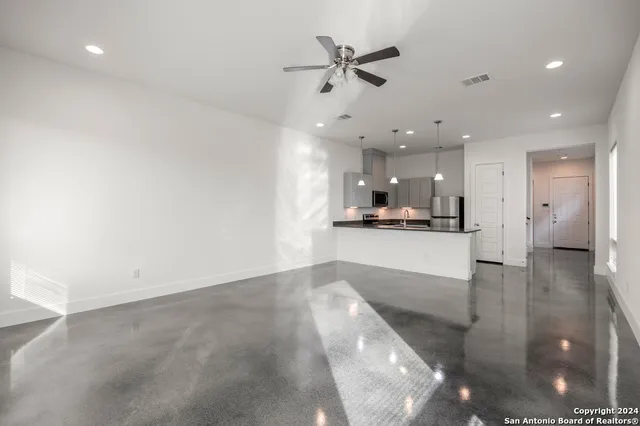 a view of a kitchen with a sink and an oven